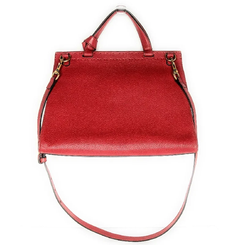 Women Gucci Sylvie bags featuring the signature web stripeGucci Red GG Marmont Top Handle Bag