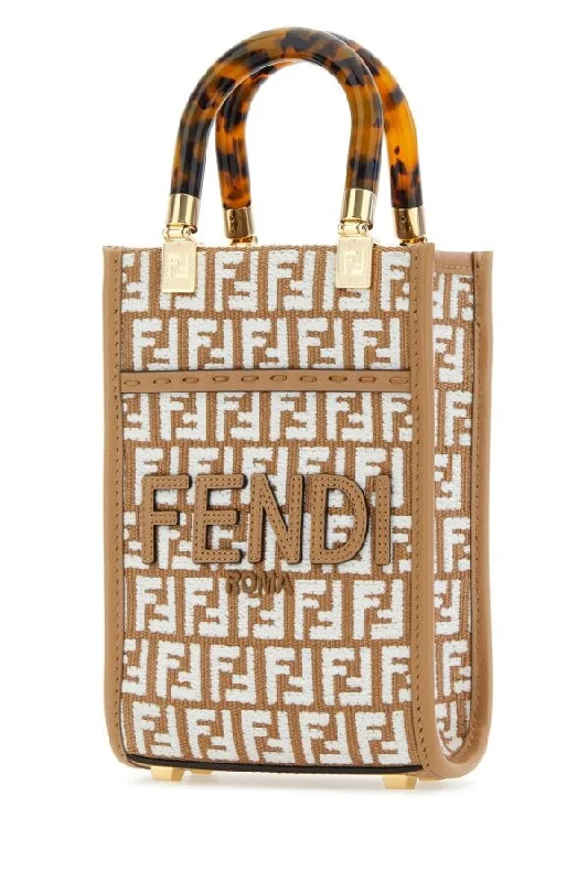 Fendi handbags with a holographic FF logo for a futuristic and trendy lookFendi Woman Embroidered Fabric Mini Sunshine Handbag